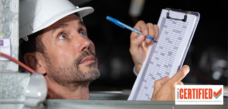Brisbane pest inspector doing termite report on clipboard