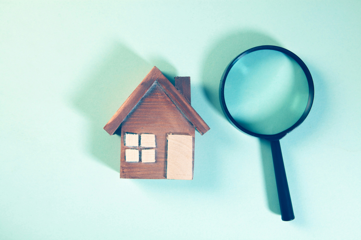 home with magnifying glass